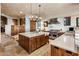 Expansive gourmet kitchen features stainless steel appliances, center island, and custom cabinetry at 9920 E Honey Mesquite Dr # 155, Scottsdale, AZ 85262