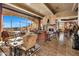Inviting living room featuring a stone fireplace and scenic views from expansive curved windows at 9920 E Honey Mesquite Dr # 155, Scottsdale, AZ 85262