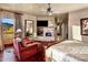 Inviting main bedroom boasts a stone fireplace, hardwood floors, and comfortable seating area at 9920 E Honey Mesquite Dr # 155, Scottsdale, AZ 85262