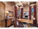 Office with rich wood accents, multiple windows, and traditional furnishings at 9920 E Honey Mesquite Dr # 155, Scottsdale, AZ 85262