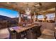 Charming patio with outdoor dining area showcasing desert landscape and sunset at 9920 E Honey Mesquite Dr # 155, Scottsdale, AZ 85262