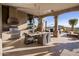 Covered patio features an outdoor kitchen, grill, and dining area with desert views at 9920 E Honey Mesquite Dr # 155, Scottsdale, AZ 85262