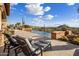 Inviting outdoor pool and lounge chairs overlooking the beautiful desert landscape at 9920 E Honey Mesquite Dr # 155, Scottsdale, AZ 85262