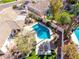 Overhead shot of a pristine pool area with a lounge seating, landscaping, and privacy fence at 10155 E Bella Vista Dr, Scottsdale, AZ 85258