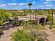 Beautiful aerial view of the property showcasing its expansive lot, lush landscaping, and unique architecture at 10290 N 117Th Pl, Scottsdale, AZ 85259