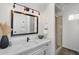 Modern bathroom featuring a white vanity, black hardware, and glass-enclosed shower at 10290 N 117Th Pl, Scottsdale, AZ 85259