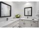 Elegant bathroom features dual sinks, quartz countertop, and modern black hardware at 10290 N 117Th Pl, Scottsdale, AZ 85259