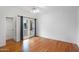 Bright bedroom featuring hardwood floors, recessed lighting, and exterior access at 10290 N 117Th Pl, Scottsdale, AZ 85259