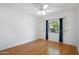 Cozy bedroom featuring hardwood floors, recessed lighting, and a large window at 10290 N 117Th Pl, Scottsdale, AZ 85259