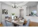 Light and bright dining room with wood table, chandelier, and easy access to other living spaces at 10290 N 117Th Pl, Scottsdale, AZ 85259