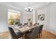 Elegant dining room with abundant natural light, complemented by stylish decor, ideal for entertaining guests at 10290 N 117Th Pl, Scottsdale, AZ 85259