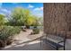 Inviting walkway leads to the entrance, with a bench for enjoying the well-manicured landscaping at 10290 N 117Th Pl, Scottsdale, AZ 85259