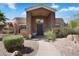 Stunning home exterior with desert landscaping and a welcoming entrance, enhancing the home's curb appeal at 10290 N 117Th Pl, Scottsdale, AZ 85259
