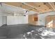 Spacious garage with ample storage cabinets and a clean, well-maintained epoxy floor at 10290 N 117Th Pl, Scottsdale, AZ 85259