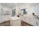 Bright, open kitchen with island, quartz countertops, stainless appliances, and ample cabinetry at 10290 N 117Th Pl, Scottsdale, AZ 85259