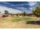 Well-maintained community green space with walking path and beautiful landscaping at 1275 E Ridgerock Loop, Casa Grande, AZ 85122