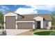 Charming single-Gathering home with a three car garage, neutral colors and a tile roof at 1275 E Ridgerock Loop, Casa Grande, AZ 85122