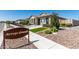 Arroyo Grande homesite with wrought iron gate and low-maintenance landscaping at 1275 E Ridgerock Loop, Casa Grande, AZ 85122
