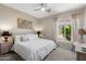 Carpeted bedroom with a large window at 12860 W Junipero Dr, Sun City West, AZ 85375