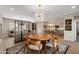 Stylish dining area with seating for six, stylish light fixture, and open layout at 12860 W Junipero Dr, Sun City West, AZ 85375