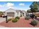 Charming home featuring a well-manicured yard and beautiful exterior architecture at 12860 W Junipero Dr, Sun City West, AZ 85375
