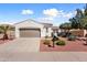 Beautiful one-story home featuring a well-manicured yard and beautiful exterior architecture at 12860 W Junipero Dr, Sun City West, AZ 85375