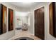 Elegant foyer with wood flooring, stylish decor, and an inviting view into the living area at 12860 W Junipero Dr, Sun City West, AZ 85375
