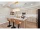 Well-appointed kitchen with stainless steel appliances, marble countertops, and ample cabinet space at 12860 W Junipero Dr, Sun City West, AZ 85375
