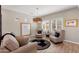 Comfortable living room featuring stylish furniture, and bright windows at 12860 W Junipero Dr, Sun City West, AZ 85375