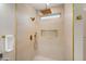Modern shower with gold accents and tiled walls at 12860 W Junipero Dr, Sun City West, AZ 85375