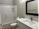 Bathroom features white cabinets, quartz countertop, shower with tub and curtains for privacy and functionality at 1444 W Spruce Dr, Chandler, AZ 85286