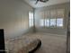 Spacious carpeted bedroom with plantation shutters on the windows at 1444 W Spruce Dr, Chandler, AZ 85286