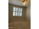 Bedroom featuring a ceiling fan, a window with shutters, and carpet flooring at 1444 W Spruce Dr, Chandler, AZ 85286