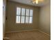 Bedroom featuring a window with shutters, a ceiling fan, and carpet flooring at 1444 W Spruce Dr, Chandler, AZ 85286