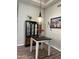 Charming dining area featuring a glass cabinet and decorative lighting at 1444 W Spruce Dr, Chandler, AZ 85286