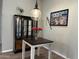 Charming dining area featuring a glass cabinet and decorative lighting at 1444 W Spruce Dr, Chandler, AZ 85286