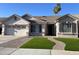 Charming single-story home with a well-maintained front yard and a two-car garage at 1444 W Spruce Dr, Chandler, AZ 85286