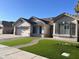 Street view of a single-story home with a manicured front lawn and a brick-paved walkway at 1444 W Spruce Dr, Chandler, AZ 85286