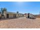 Spacious backyard with gravel landscaping, shed, and ample sunlight at 1646 W Fairmont Dr, Tempe, AZ 85282