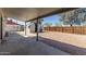 Expansive backyard with covered patio, storage shed, and gravel landscaping at 1646 W Fairmont Dr, Tempe, AZ 85282