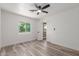 Bright bedroom featuring wood-look flooring, neutral walls, and natural light at 1646 W Fairmont Dr, Tempe, AZ 85282