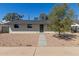 Charming single-story home with desert landscaping, rock cover, and a well-maintained front yard at 1646 W Fairmont Dr, Tempe, AZ 85282