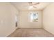 Bright, spacious bedroom with neutral carpet, a ceiling fan, and private balcony access at 1941 S Pierpont Dr # 2141, Mesa, AZ 85206