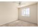 Cozy bedroom with a ceiling fan, plush carpeting, and a bright window at 1941 S Pierpont Dr # 2141, Mesa, AZ 85206