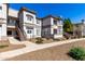 Exterior view of a multi-story residential building with well-kept grounds at 1941 S Pierpont Dr # 2141, Mesa, AZ 85206