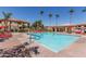 Relaxing community pool with inviting lounge chairs and lush landscaping at 1941 S Pierpont Dr # 2141, Mesa, AZ 85206