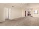 Expansive living room with neutral colors and a ceiling fan, ready for personalization at 1941 S Pierpont Dr # 2141, Mesa, AZ 85206
