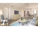 Bright living room featuring neutral colors, a ceiling fan, and seamlessly flowing into a dining area at 1941 S Pierpont Dr # 2141, Mesa, AZ 85206