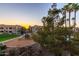 Overview of the community playground, adjacent lawn, and residential buildings at 1941 S Pierpont Dr # 2141, Mesa, AZ 85206