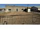 Backyard with a view of a cinderblock home, showing fencing and a dirt yard at 206 S 5Th St, Buckeye, AZ 85326